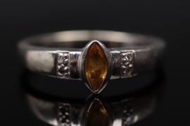 White golden ring with yellow sapphire and diamonds