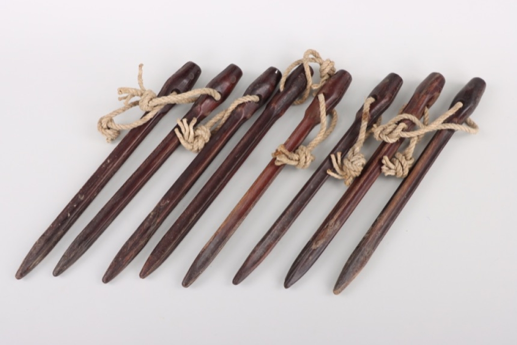 Eight Wehrmacht bakelit tent pins