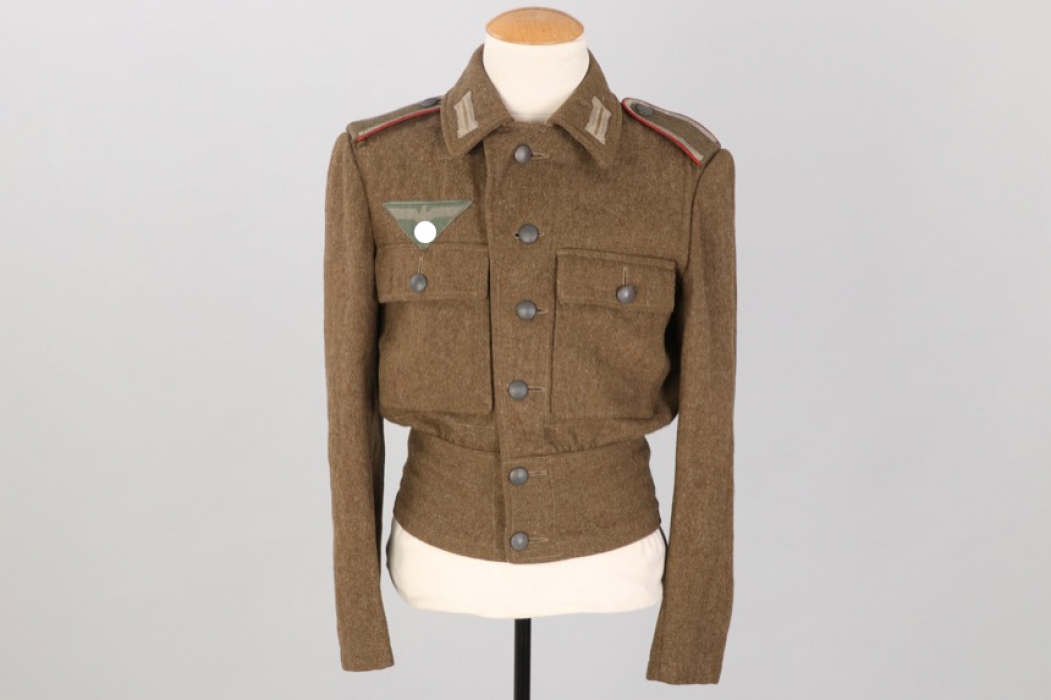 Heer M44 Artillerie field tunic to Uffz. Wolf